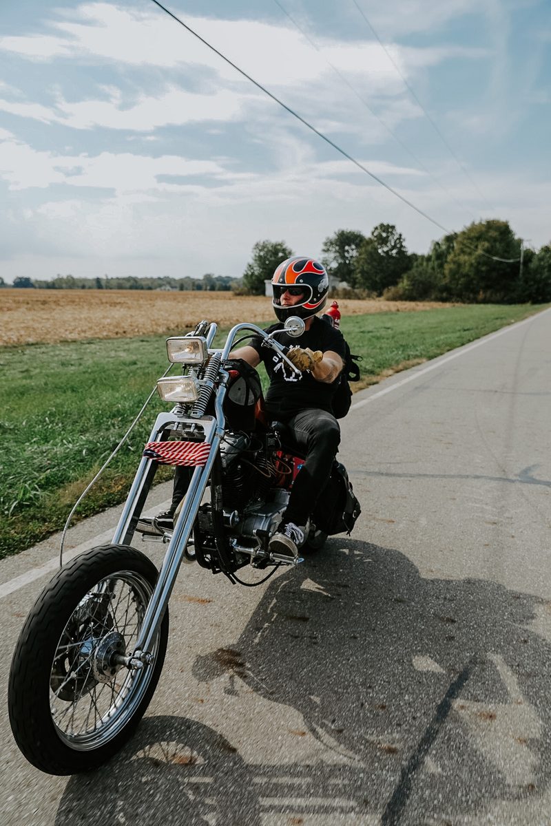 Jake riding a custom chopper down a country road