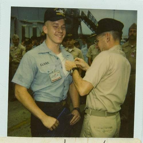 Jake’s commanding officer pinning the Submarine Warfare insignia on his uniform